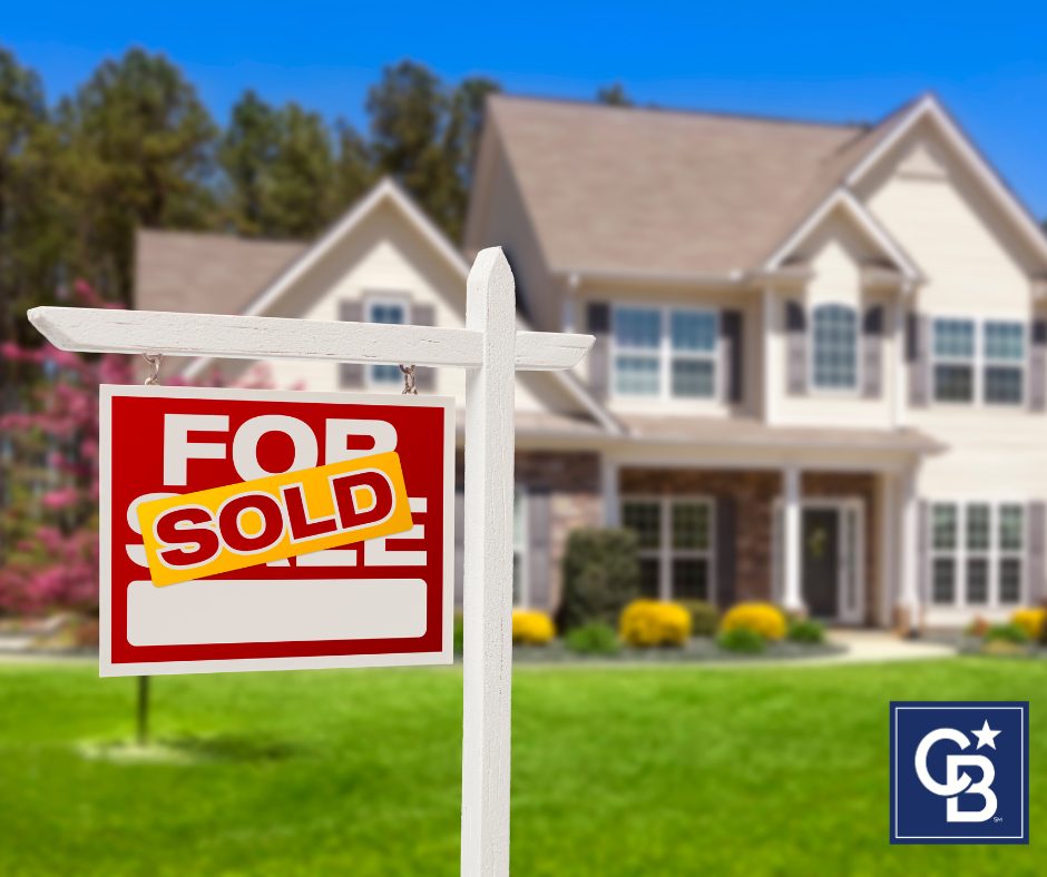 A "SOLD" sign in the front yard of a well-marketed home, highlighting how a real estate agent markets your home effectively.