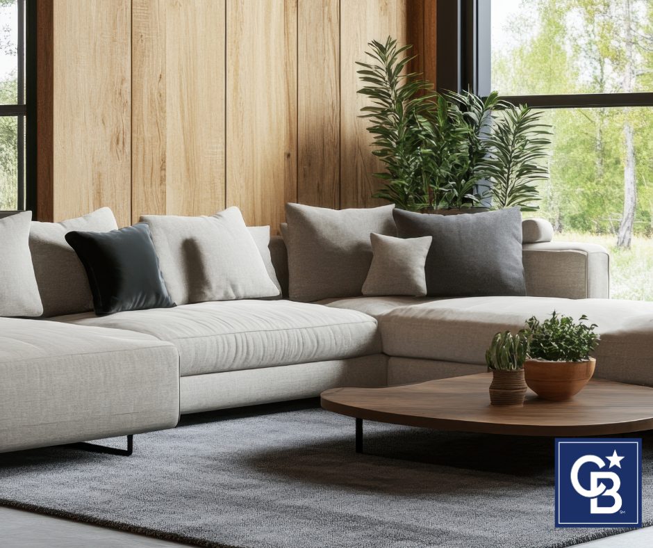 Reclaimed wood accent wall in a great room with a couch and coffee table adding warmth and rustic charm to the space.