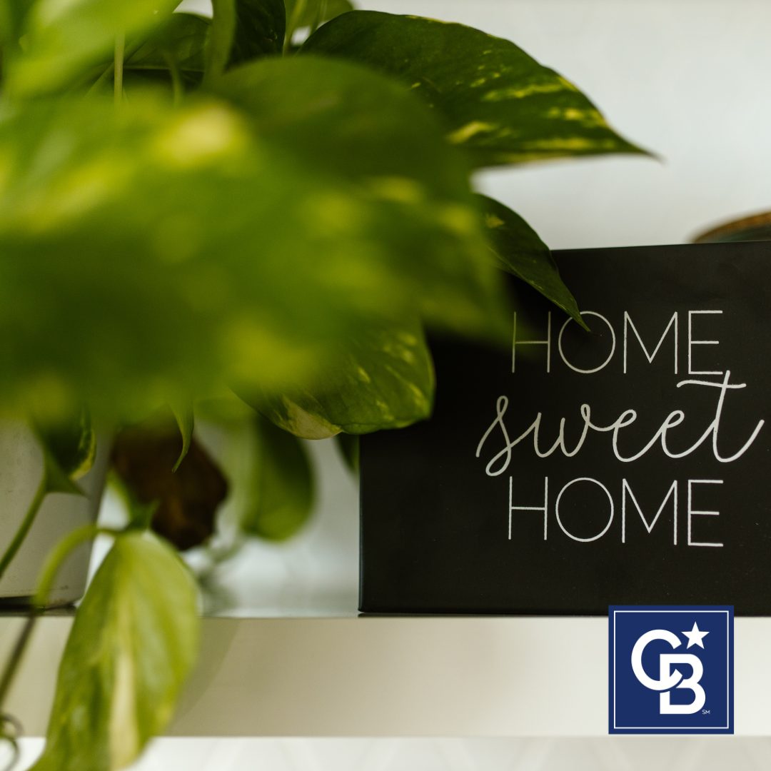 Home sweet home sign on a table next to a plant, symbolizing how a flexible home wish list helps buyers find the right home